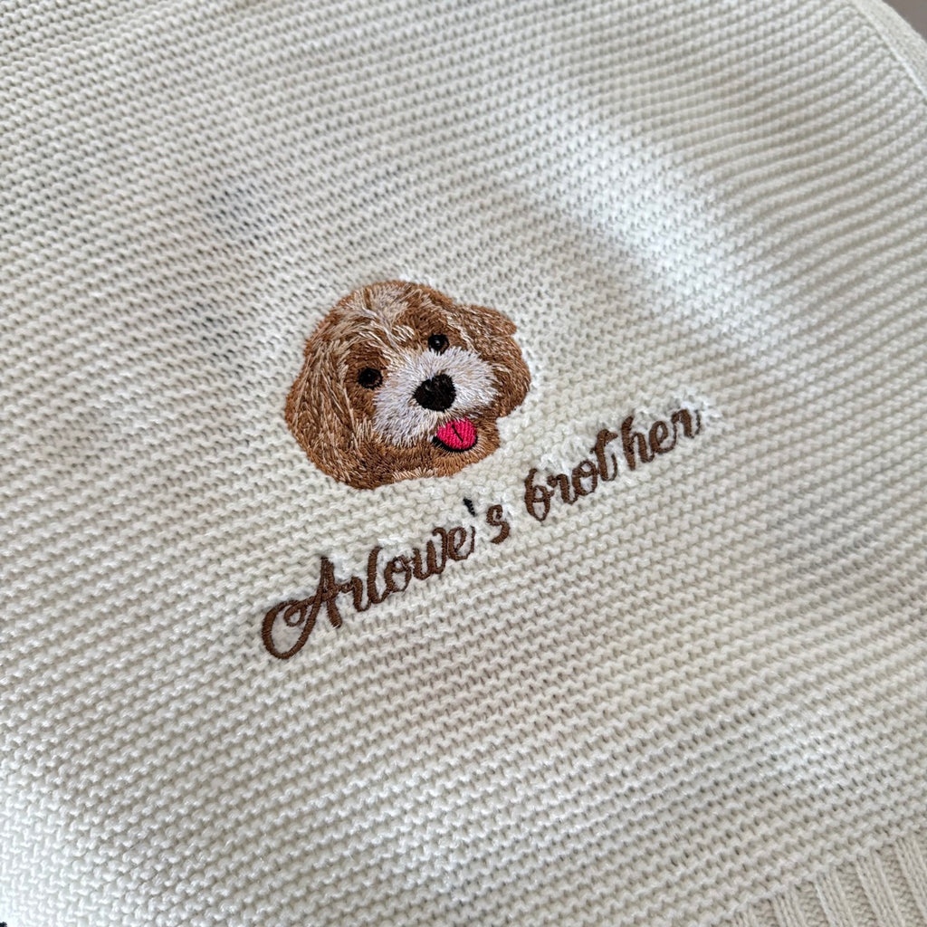 Cream knitted blanket with embroidered dog portrait
